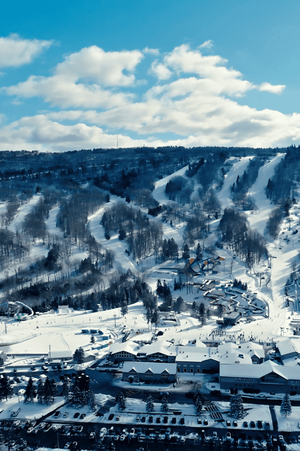 Snow-covered ski resort with scenic mountain view and ski slopes in winter season.