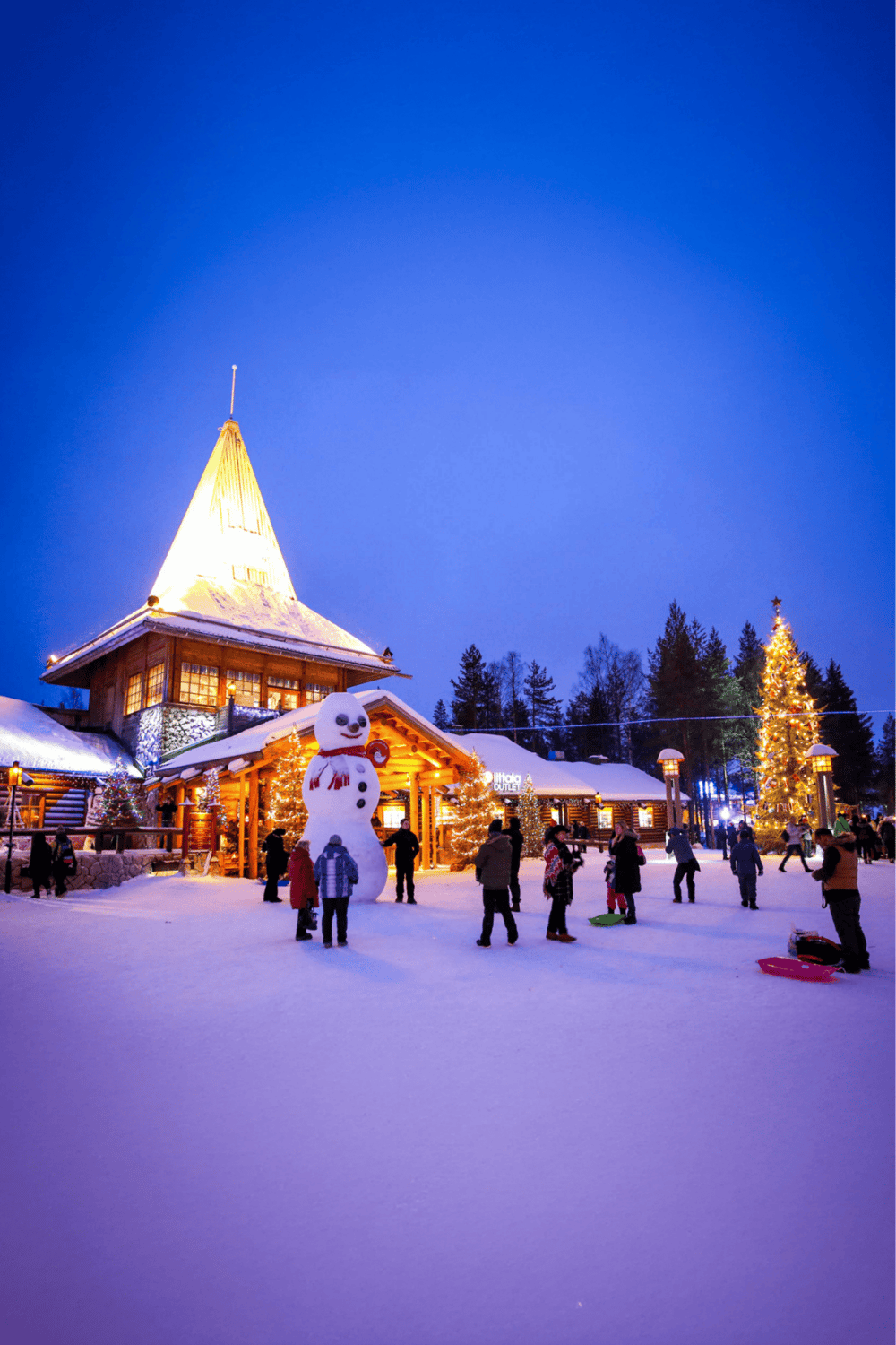 Festive winter scene at QuestForDirections holiday destination with snow, Christmas trees, and a snowman.