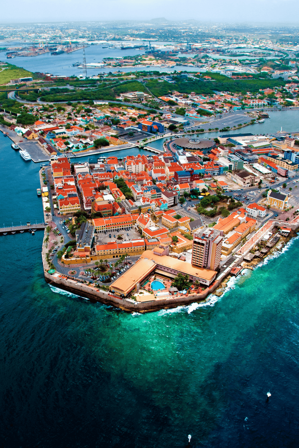 Vibrant aerial view of Nassau, Bahamas, showcasing colorful colonial architecture and stunning waterfront scenery.