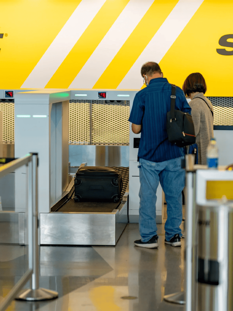 Secure luggage check-in at QuestForDirections travel safety solutions airport.