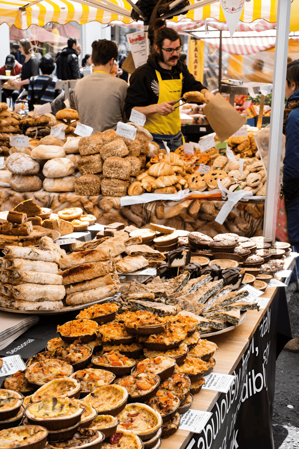 Delicious baked goods and pastries at outdoor market stalls for gourmet food shopping.