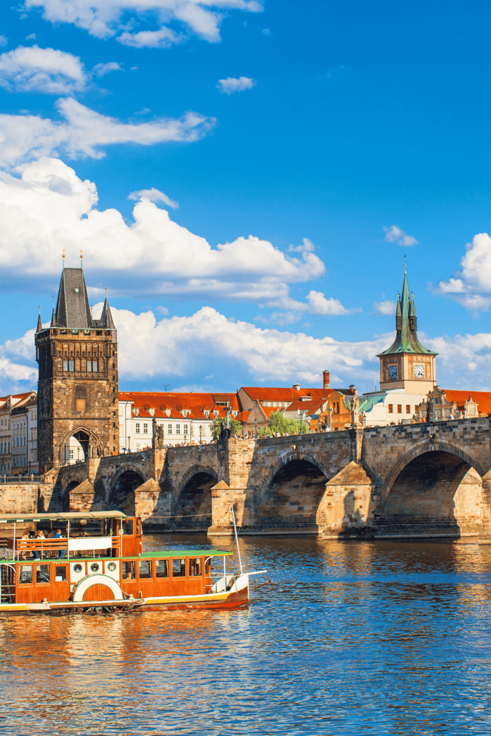 Historic Prague Charles Bridge and Old Town architecture, scenic river view, guided tours, travel destinations.