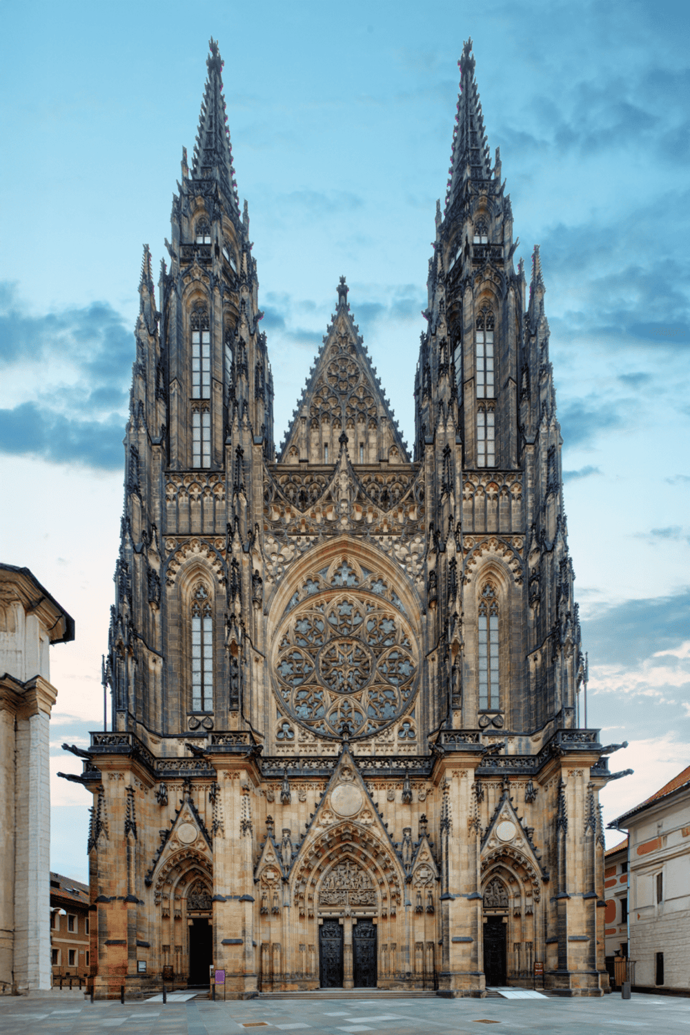 Gothic cathedral with intricate architecture, twin spires, and rose window, located in Prague.