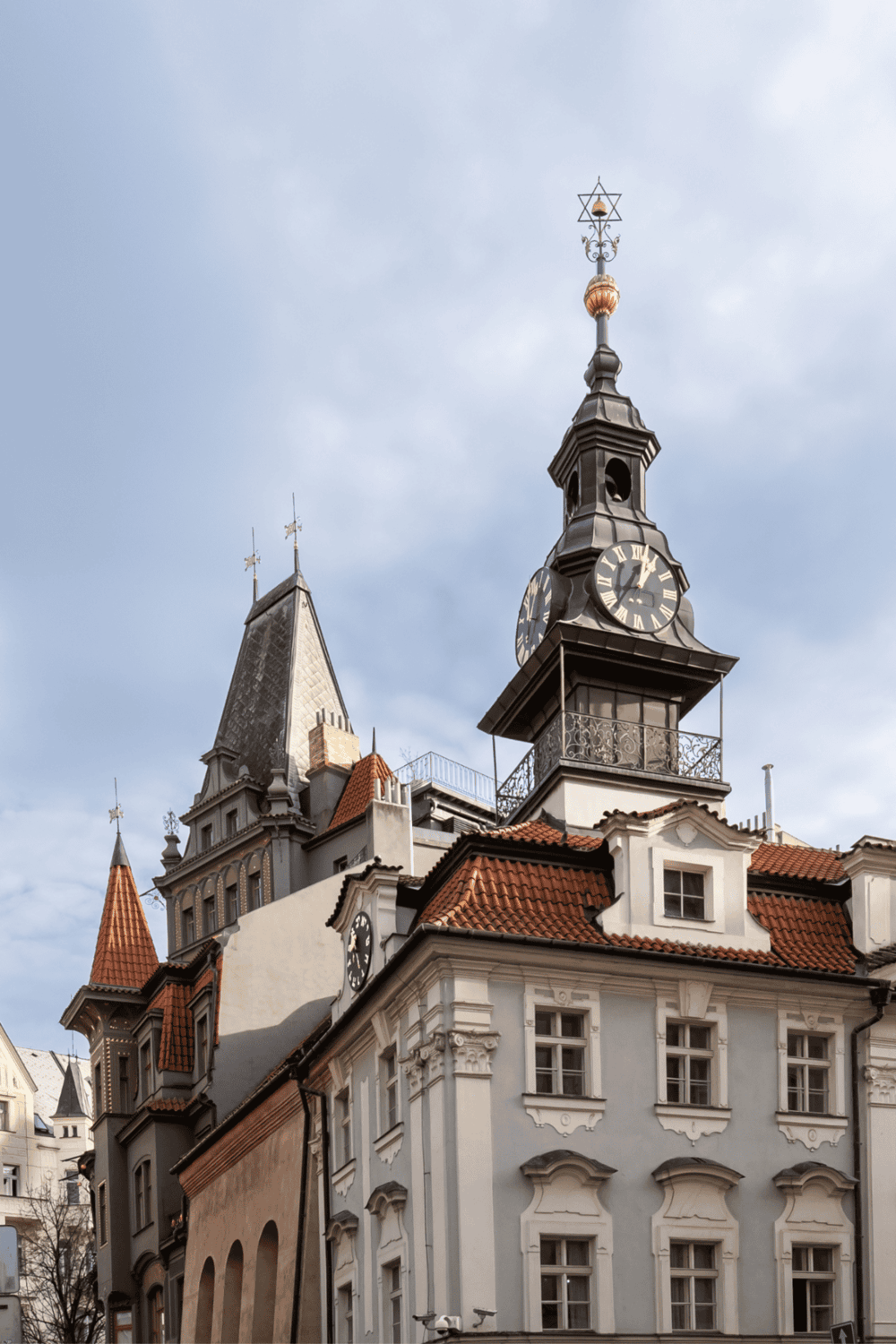 Historic clock tower with ornate architecture in Prague, Czech Republic.