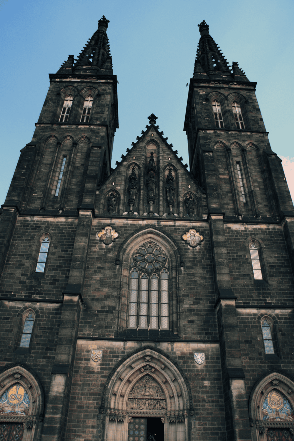 Majestic Gothic church with twin spires and detailed stonework from QuestForDirections.