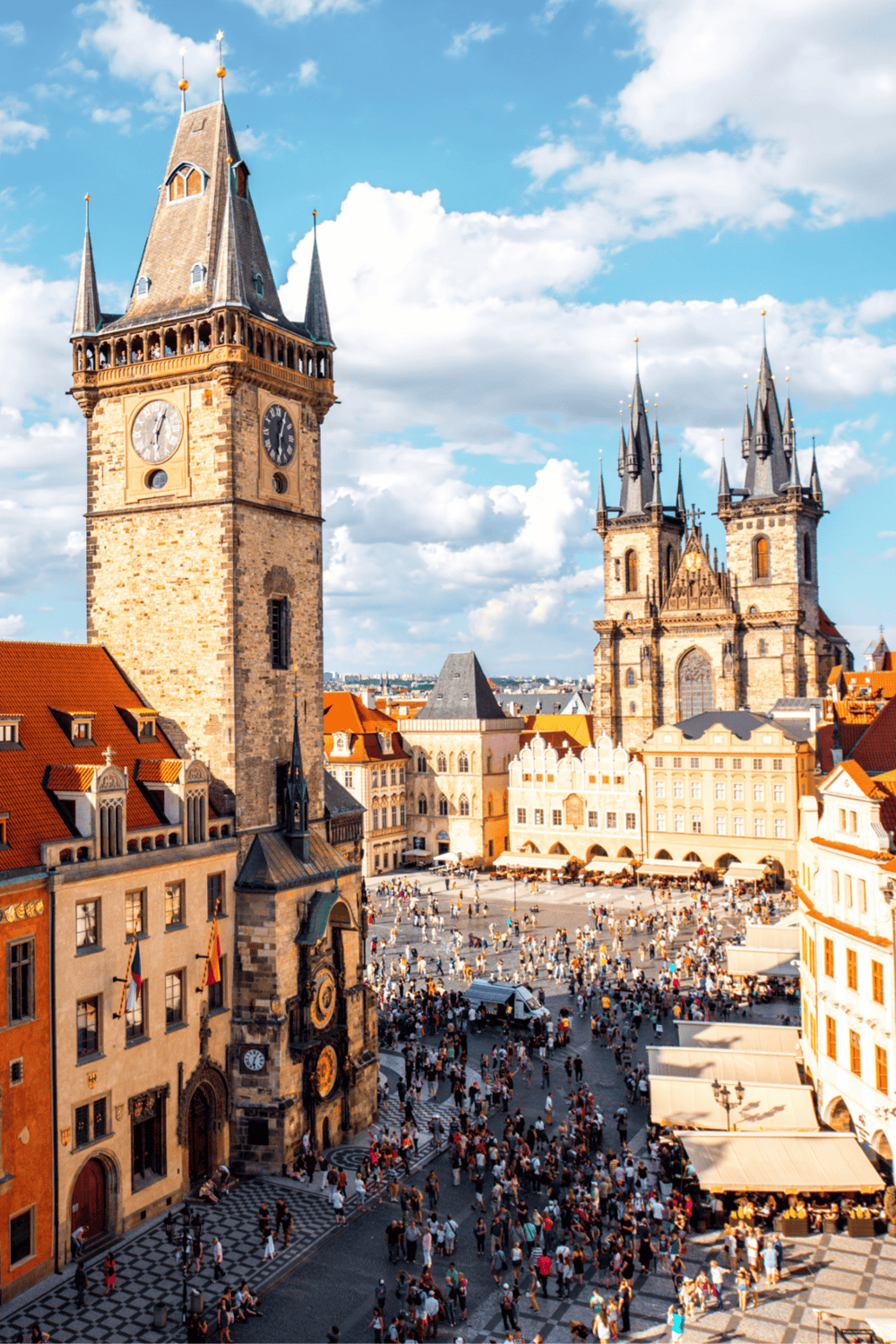 Historic Prague Old Town Square with Astronomical Clock and Tyn Church, popular tourist destination in Czech Republic.
