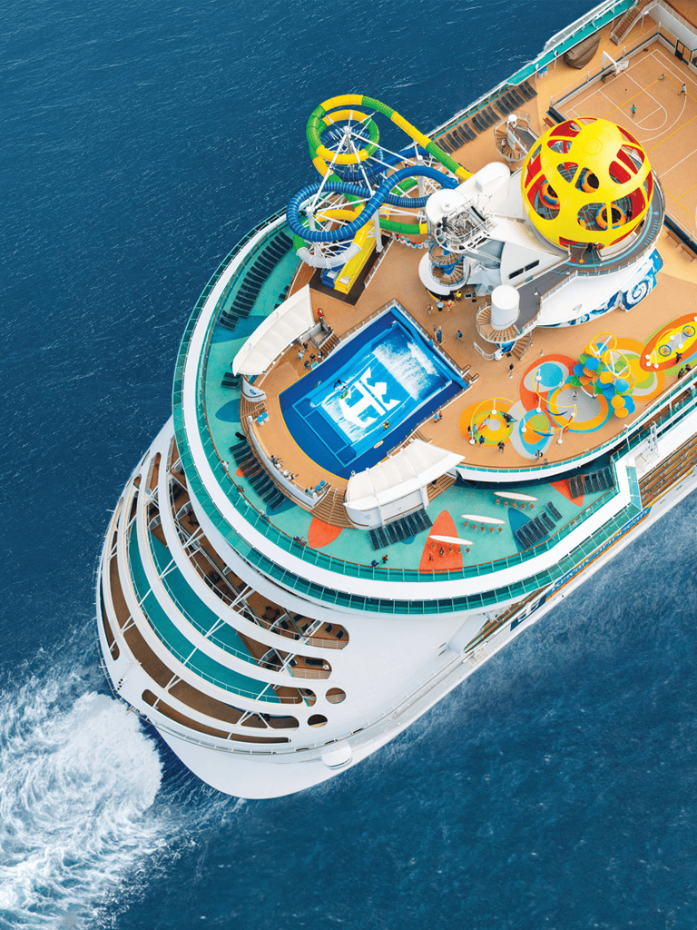 Water park on a cruise ship with water slides and recreational areas, outdoor pools, and entertainment facilities.