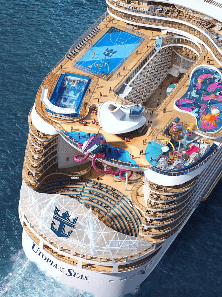 Luxurious cruise ship with water slides, pools, and sports courts on the deck, offering an exciting ocean vacation experience.