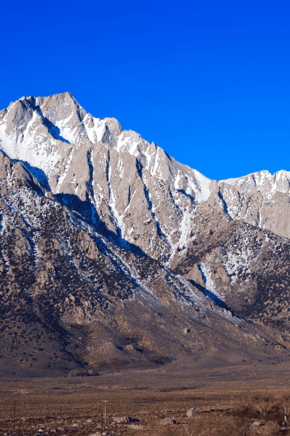 Stunning mountain landscape with snow-capped peaks in a scenic outdoor setting.