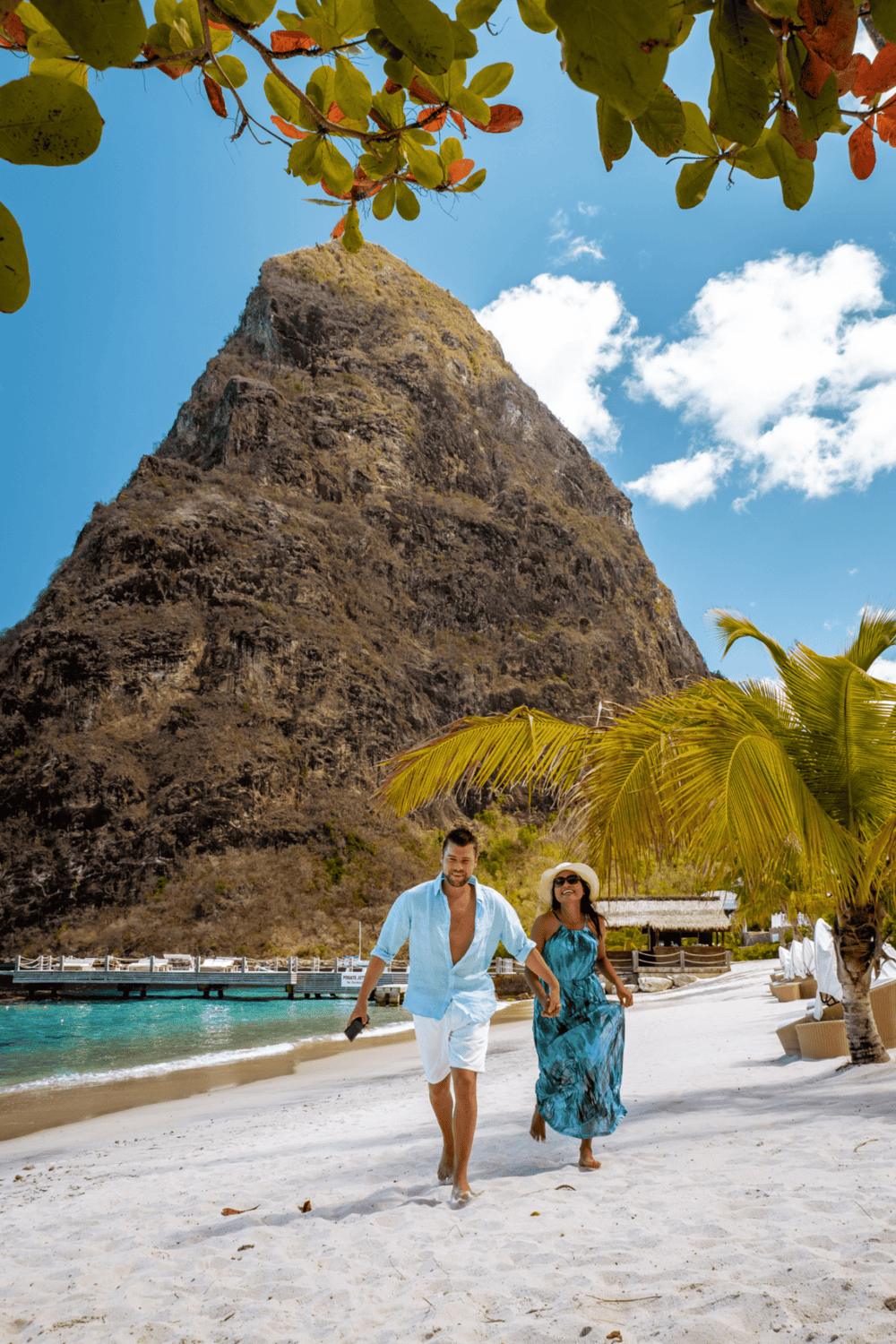 Breathtaking beach scene at QuestForDirections with mountains, palm trees, and happy travelers.