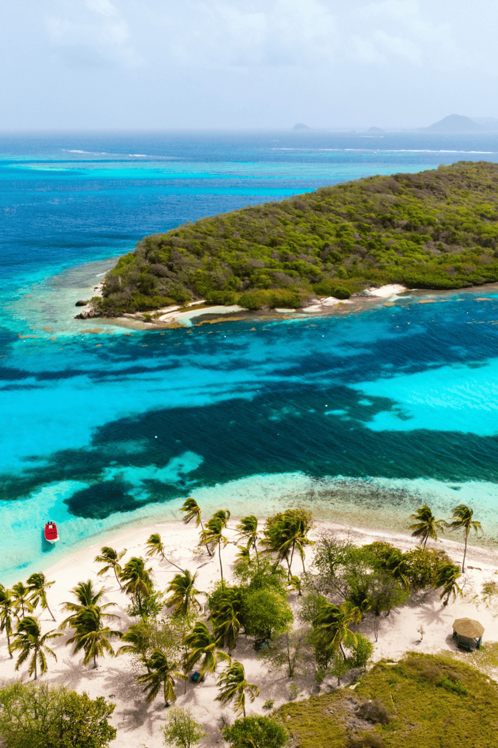 Stunning tropical island with turquoise waters and lush greenery, perfect for vacation and exploration.