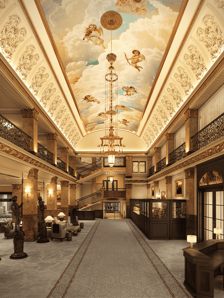Elegant hotel lobby with a grand ceiling mural featuring cherubs and clouds, ornate decor, and luxurious furnishings.