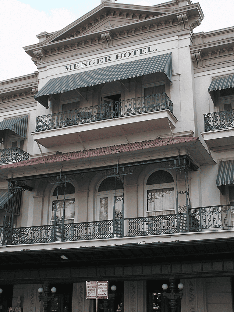 Charming historic hotel with ornate balconies and classic architecture.