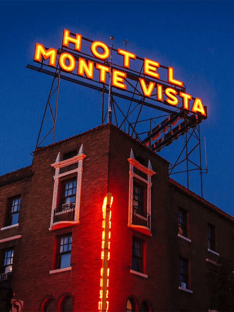 Hotel Monte Vista neon sign at dusk.