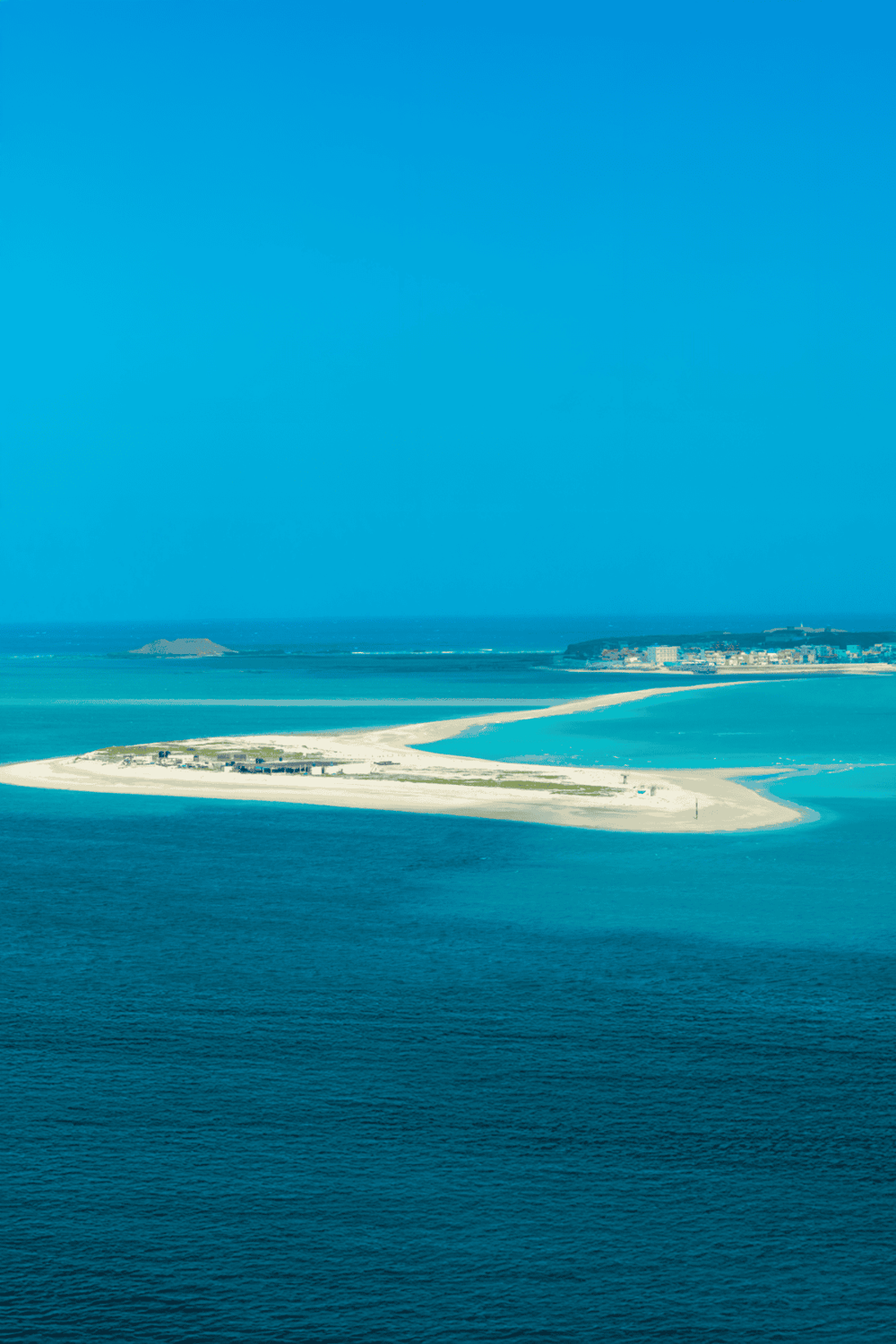 Seaside island with sandy beaches and turquoise waters, perfect for vacation and relaxation.