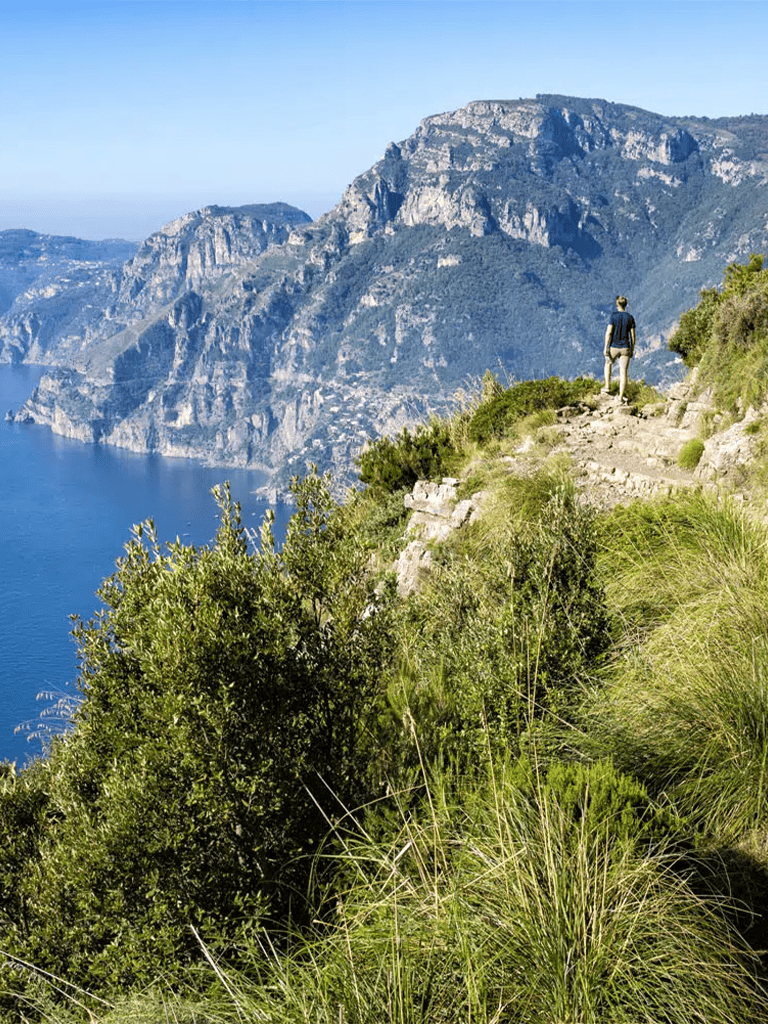 Breathtaking coastal hiking trail with scenic mountain views and lush greenery, perfect for outdoor adventures.