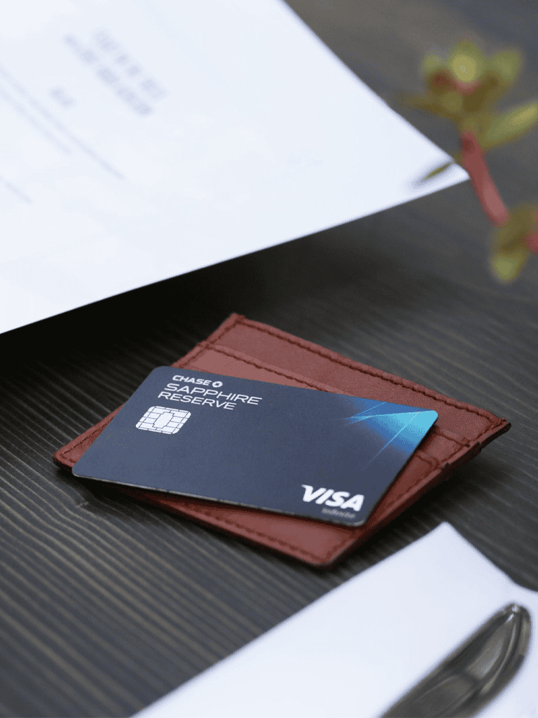 Visa credit card on a leather wallet for travel and financial management.