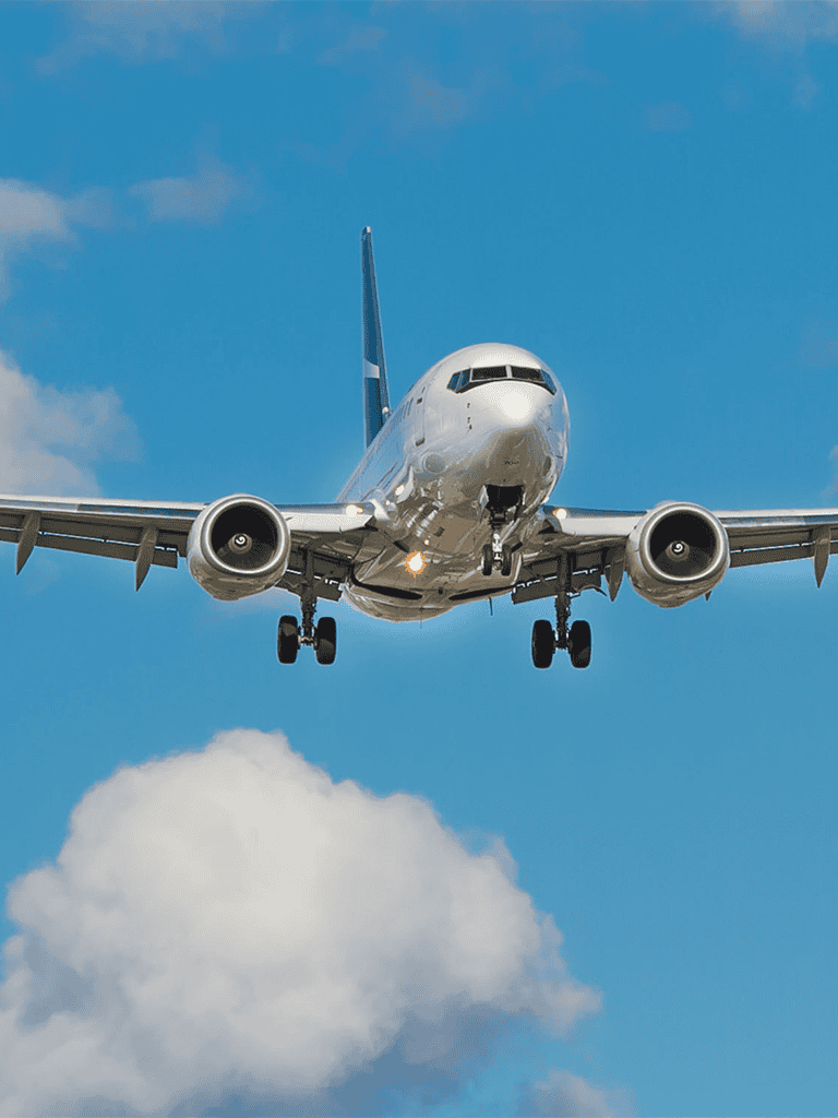 Aircraft in flight, commercial airplane, blue sky, aviation, air travel, QuestForDirections.