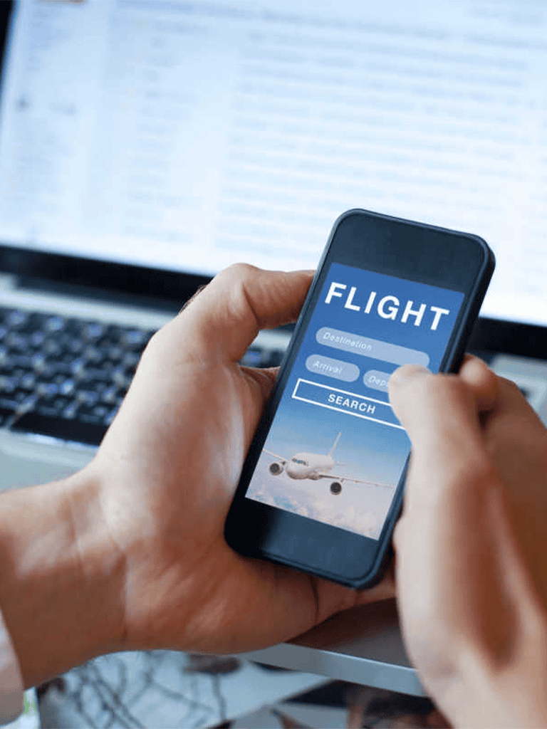1. Flight booking app on smartphone, airline ticket search, travel planning tools.