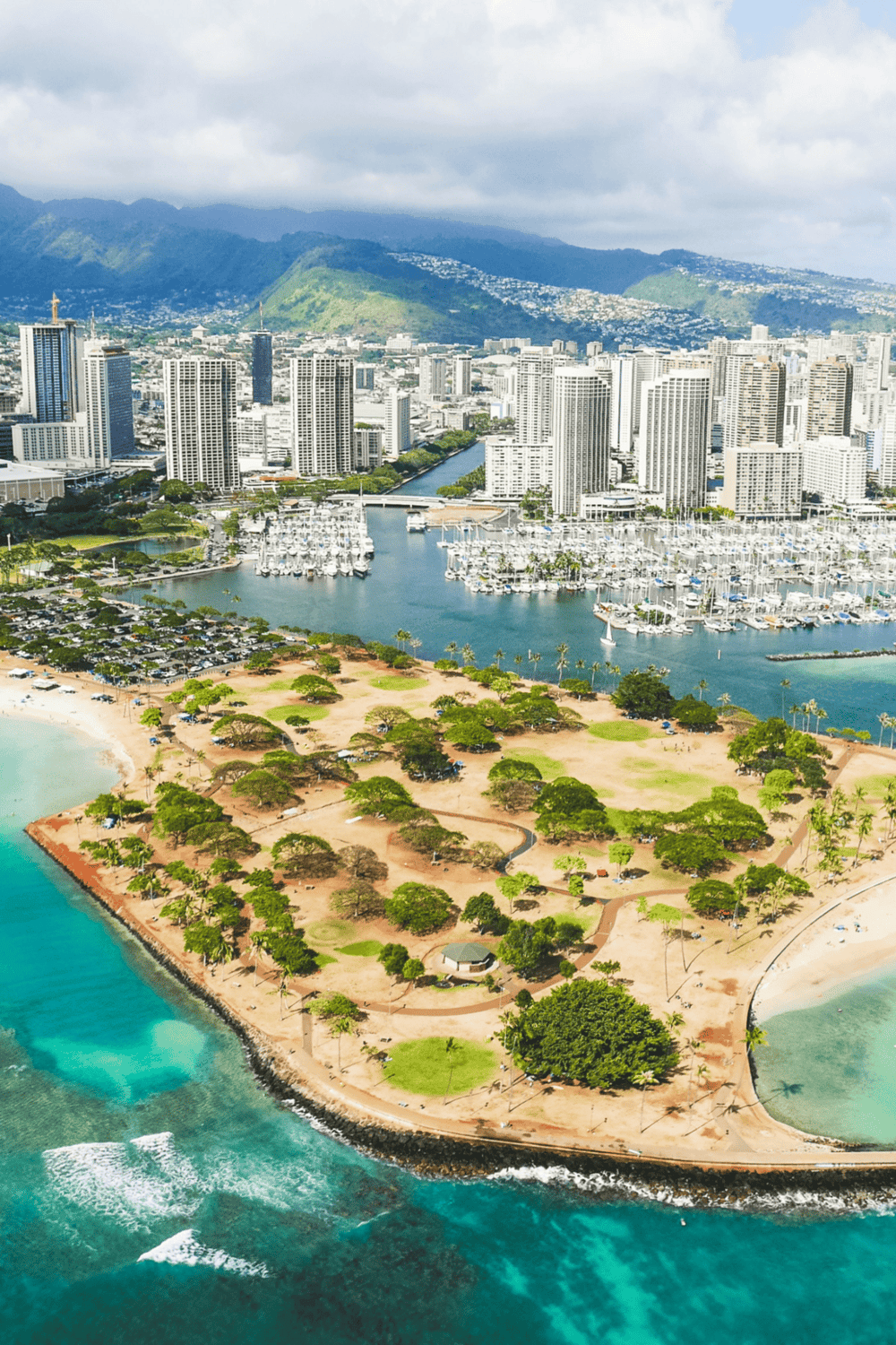 Urban Honolulu skyline with marina and ocean view, Hawaii travel destination.