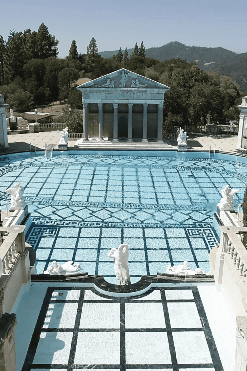 Elegant Greek-inspired swimming pool and classical architecture at Quest for Directions.