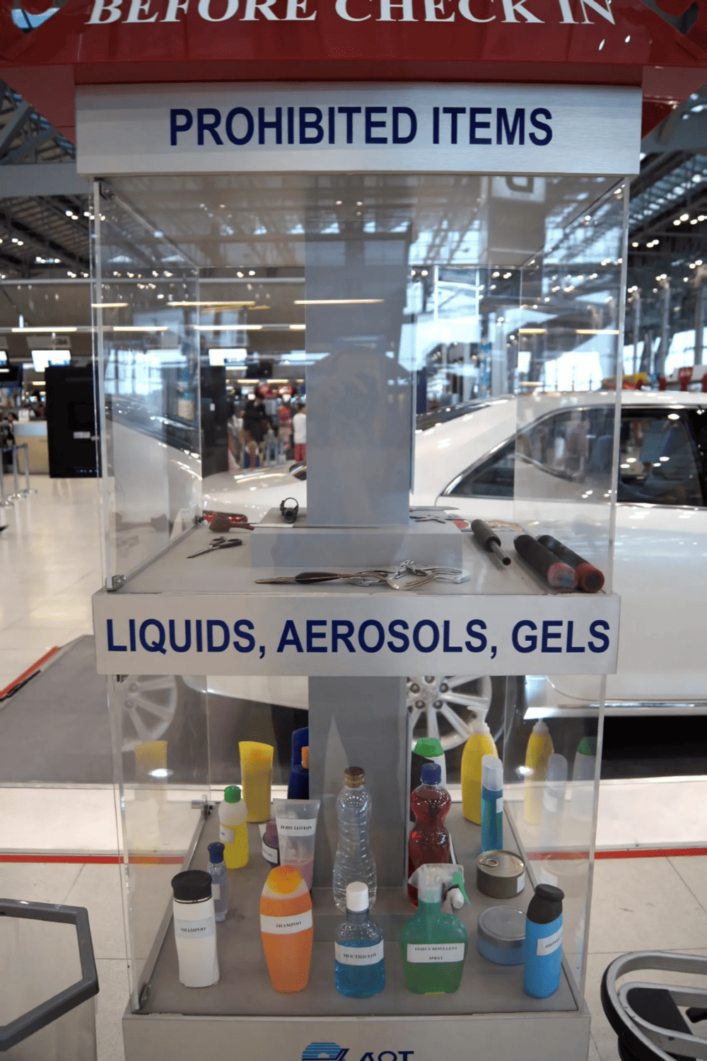 Liquids aerosols gels prohibited items display in airport security screening area.