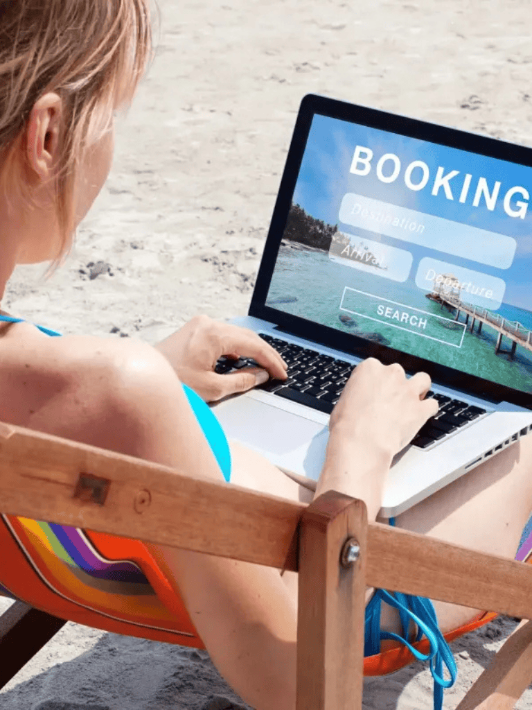 Booking vacation online search at beach resort.