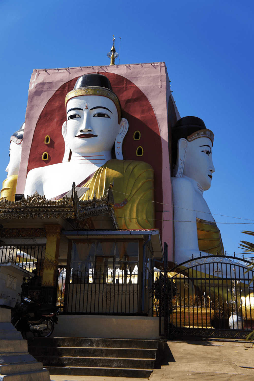Colorful giant Buddha statues in Myanmar, showcasing religious cultural heritage and spiritual significance.