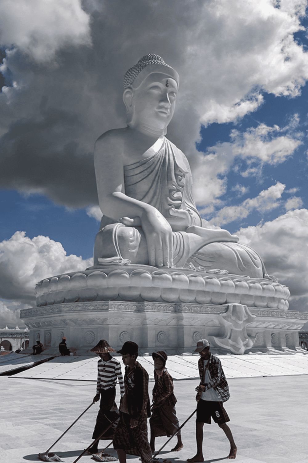 Majestic white Buddha statue at a cultural site for spiritual exploration and meditation.