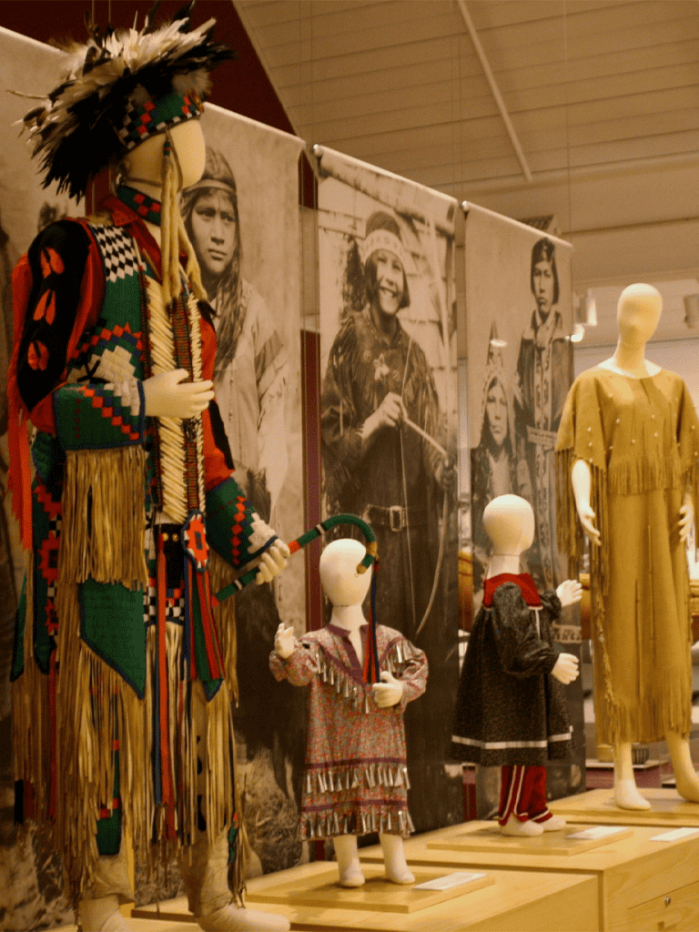 1. Native American traditional clothing display at a museum exhibit.