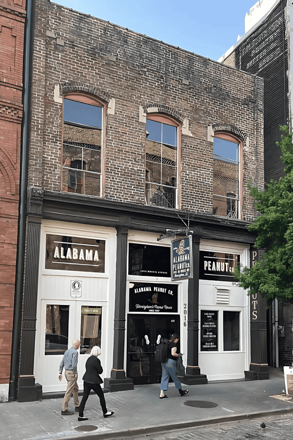 Historic brick building housing Alabama Peanut Co in downtown area.