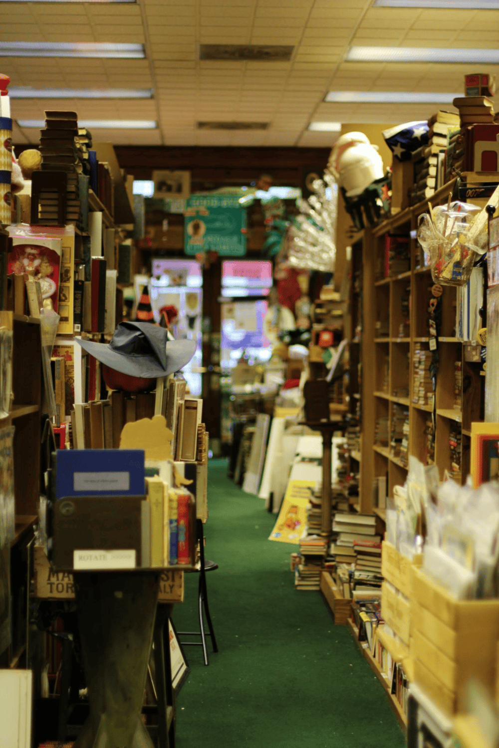Bookshelf and books in a cozy, vintage bookstore aisle with search for directions theme.