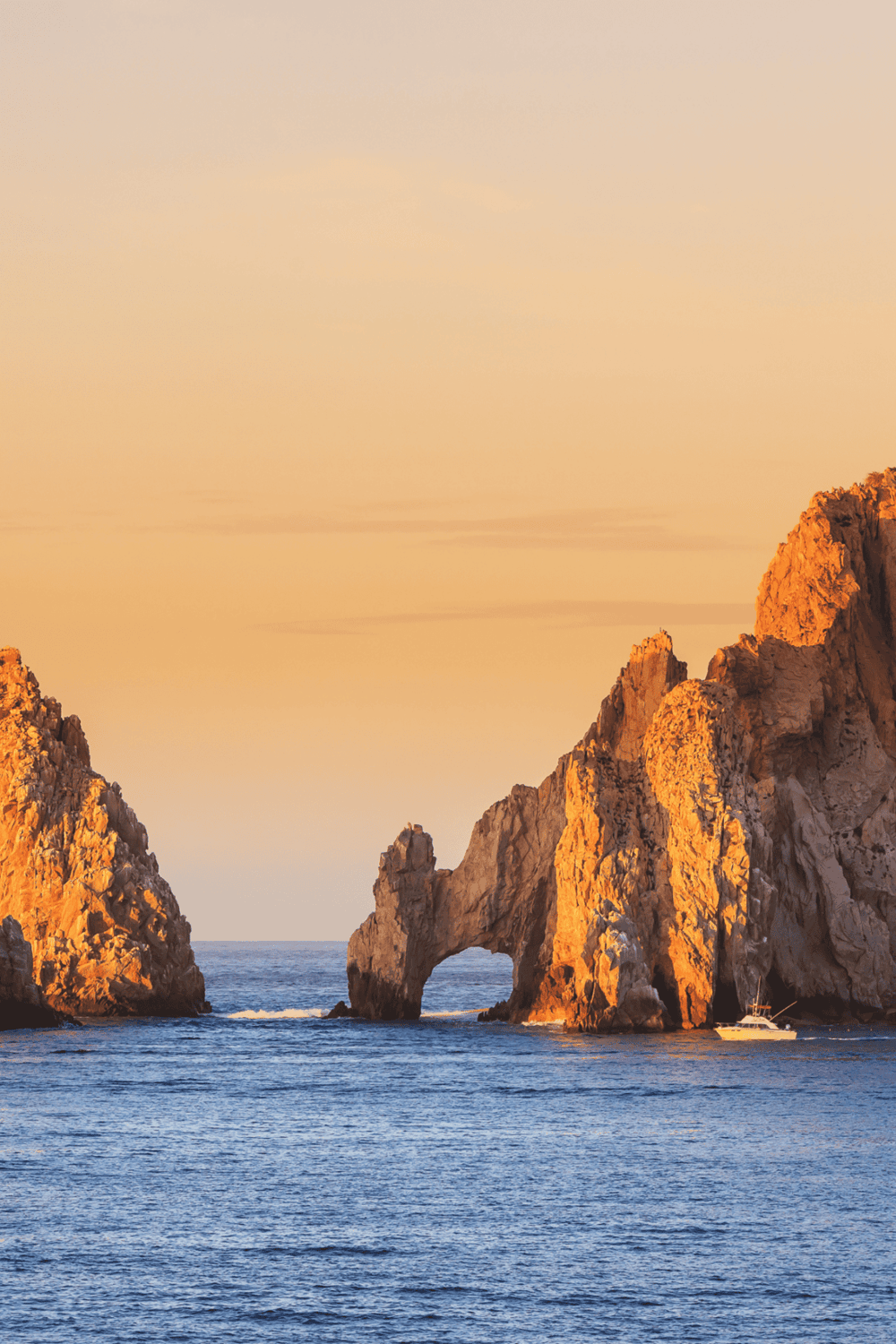 1. Arch Rock formation at sunset on the coast, scenic ocean view for travel and adventure.