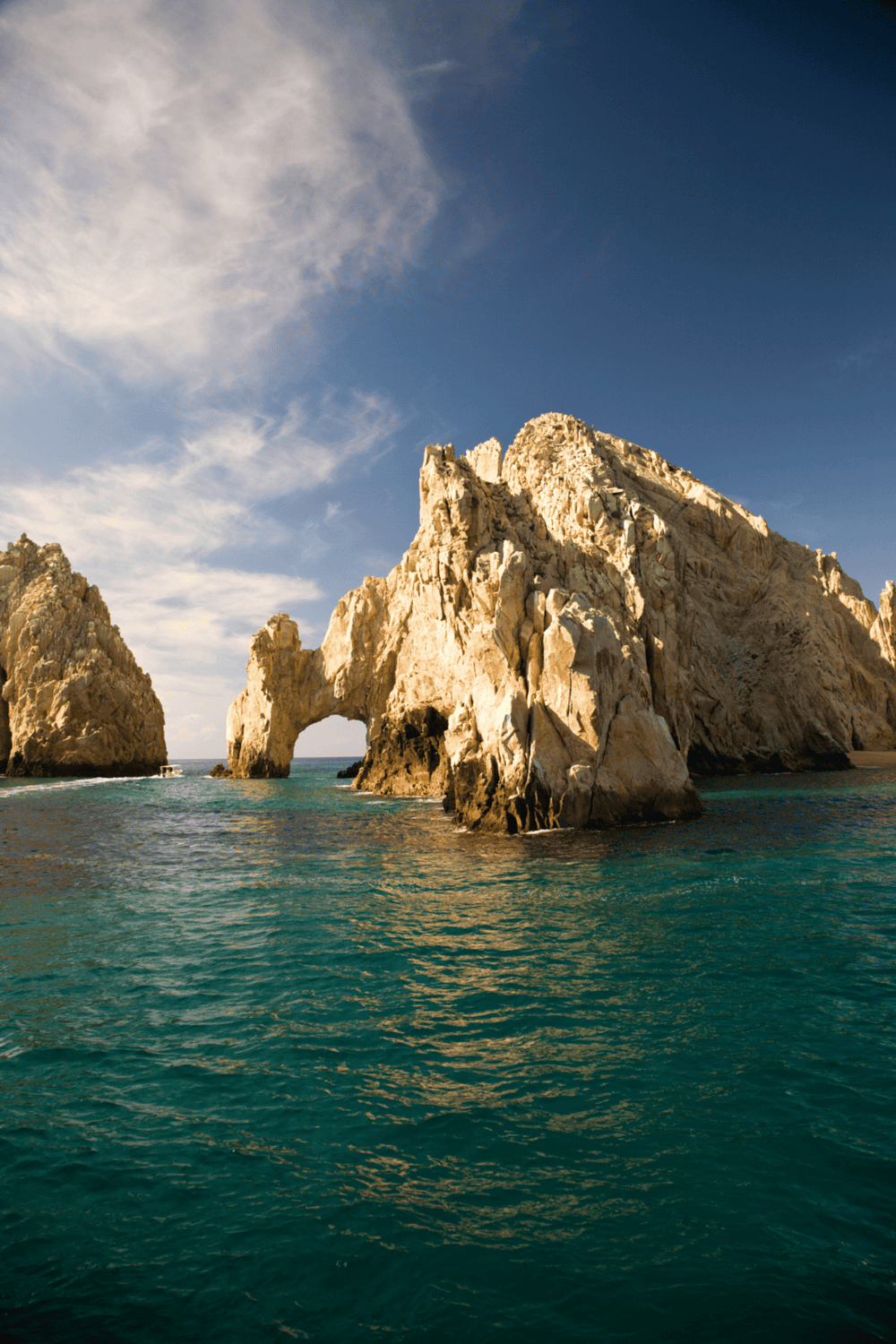 Majestic ocean arch rock formation at sunset, scenic coastal landscape, natural beauty, travel destinations.