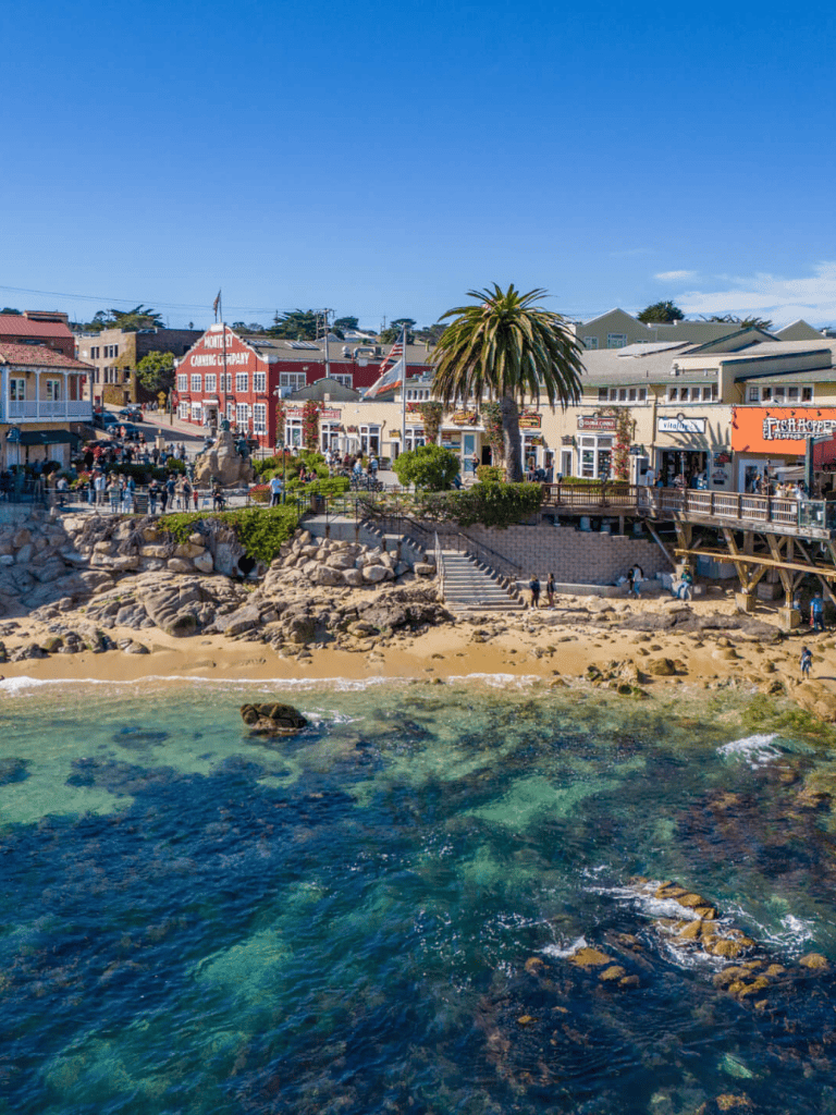 Colorful seaside town with vibrant shops and waterfront views, perfect for exploring and sightseeing.