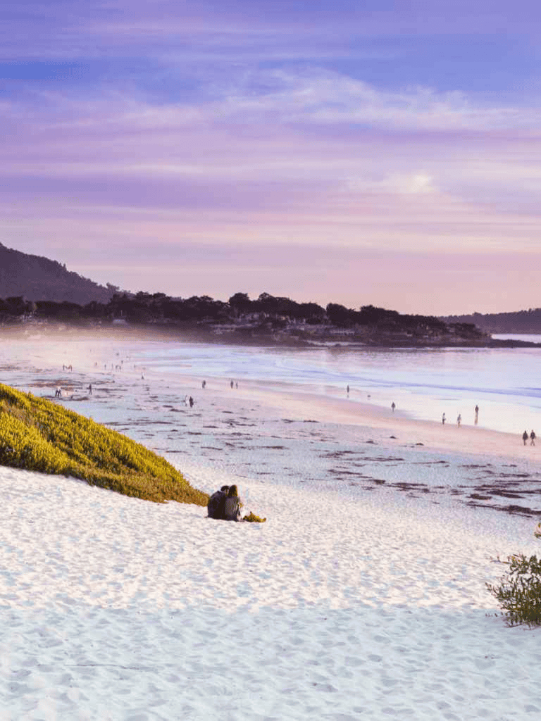 Serene beach scene with colorful sunset and relaxing atmosphere, ideal for vacation planning.