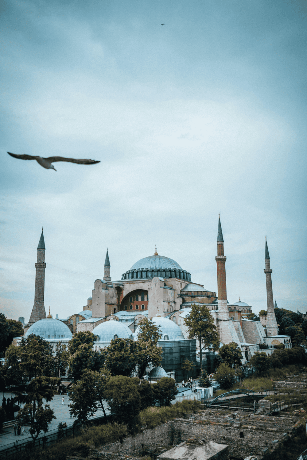 Ancient mosque with domes and minarets in Istanbul, Turkey, scenic view for travel and cultural exploration.