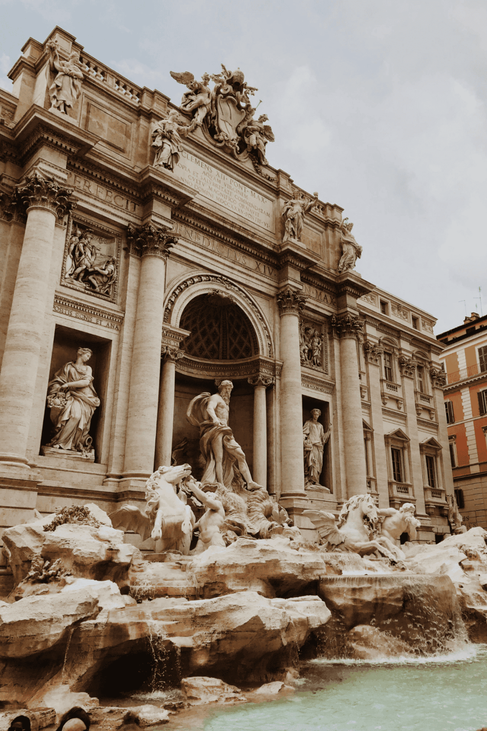 Ancient Roman Trevi Fountain in Rome, Italy, with detailed sculptures and cascading water.