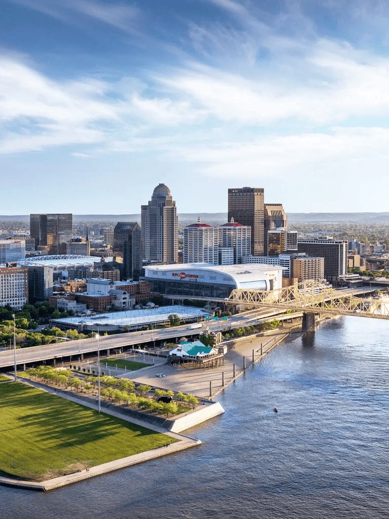 Vibrant city skyline with modern skyscrapers and river view in downtown QuestForDirections area.