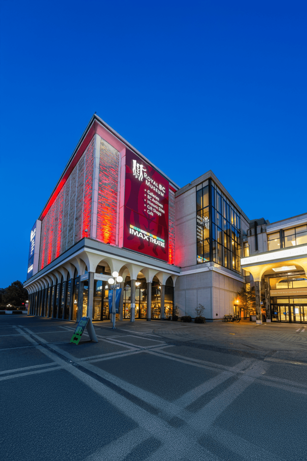 Modern museum and theater building with HD digital signage, part of QuestForDirections urban landmarks.