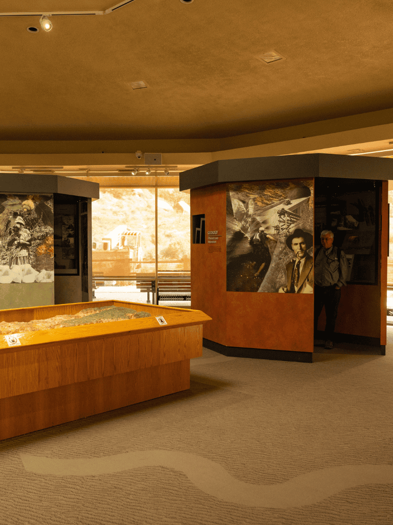 Historic military museum exhibit showcasing wartime photographs and artifacts.