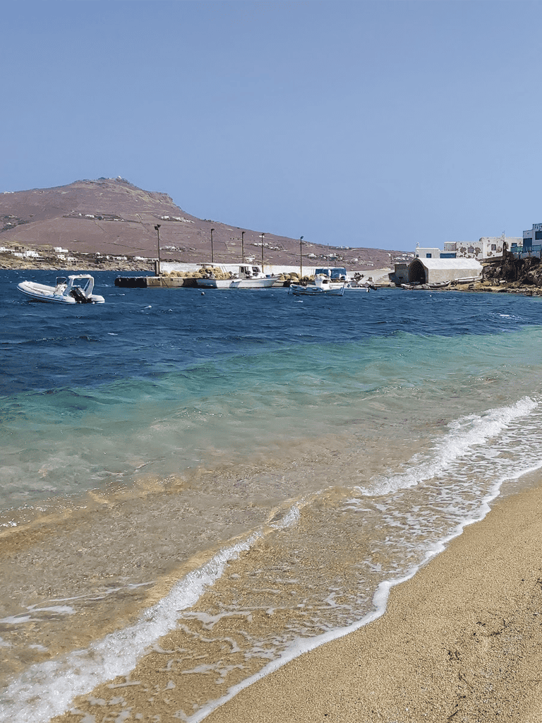 Boat marina at scenic Greek island coast.