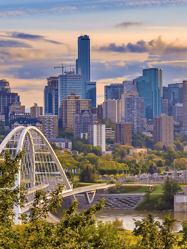 Modern downtown Austin skyline with Congress Avenue Bridge and outdoor park, Texas cityscape at sunset.