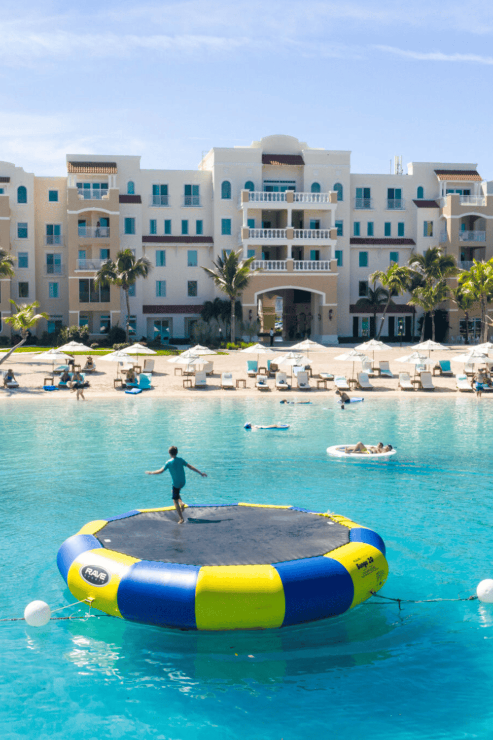 Beautiful resort with pool and beach activities, perfect for vacation relaxation and fun.