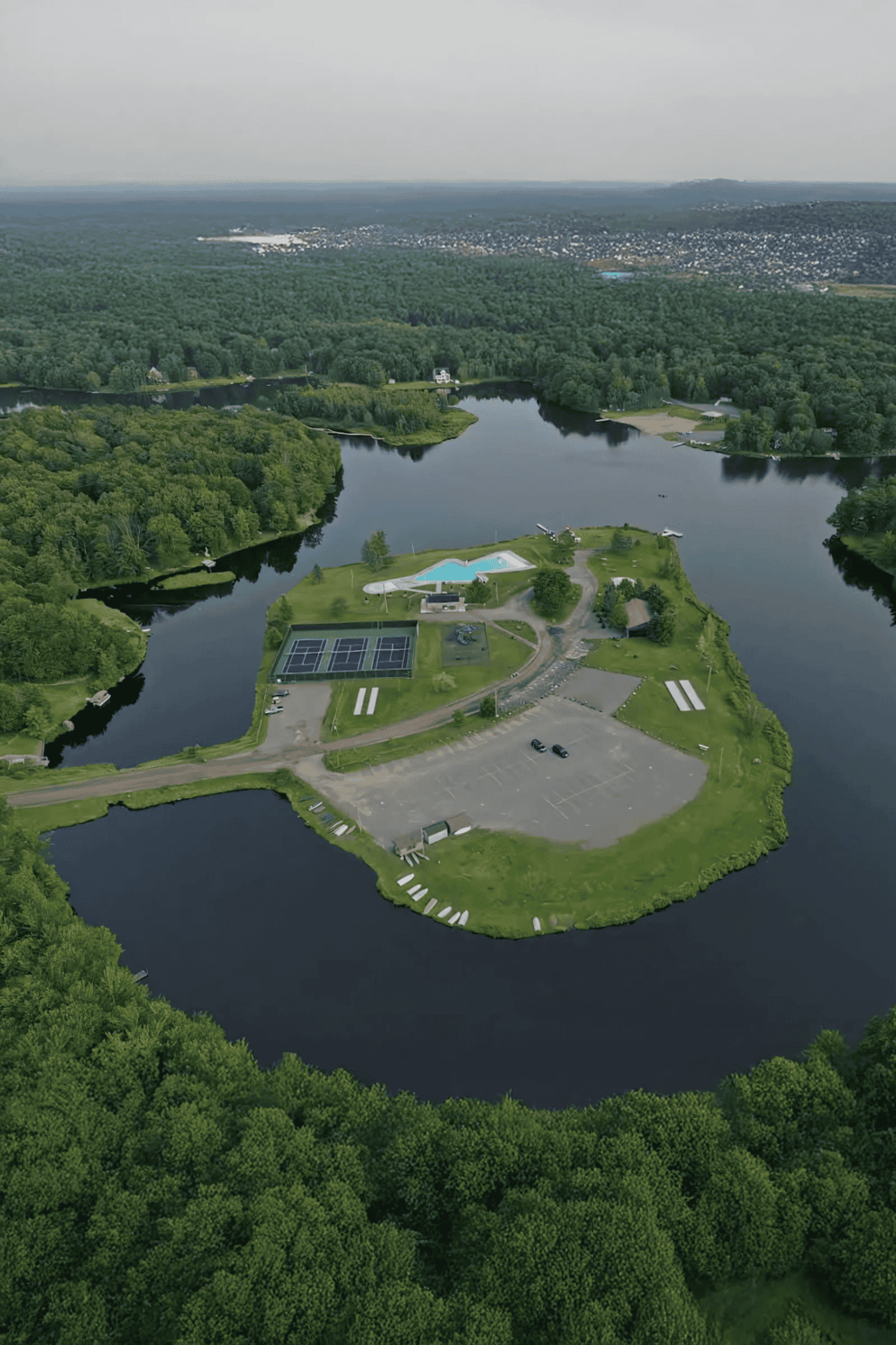 Aerial view of Quest for Directions large water park and recreational facility surrounded by lush greenery.