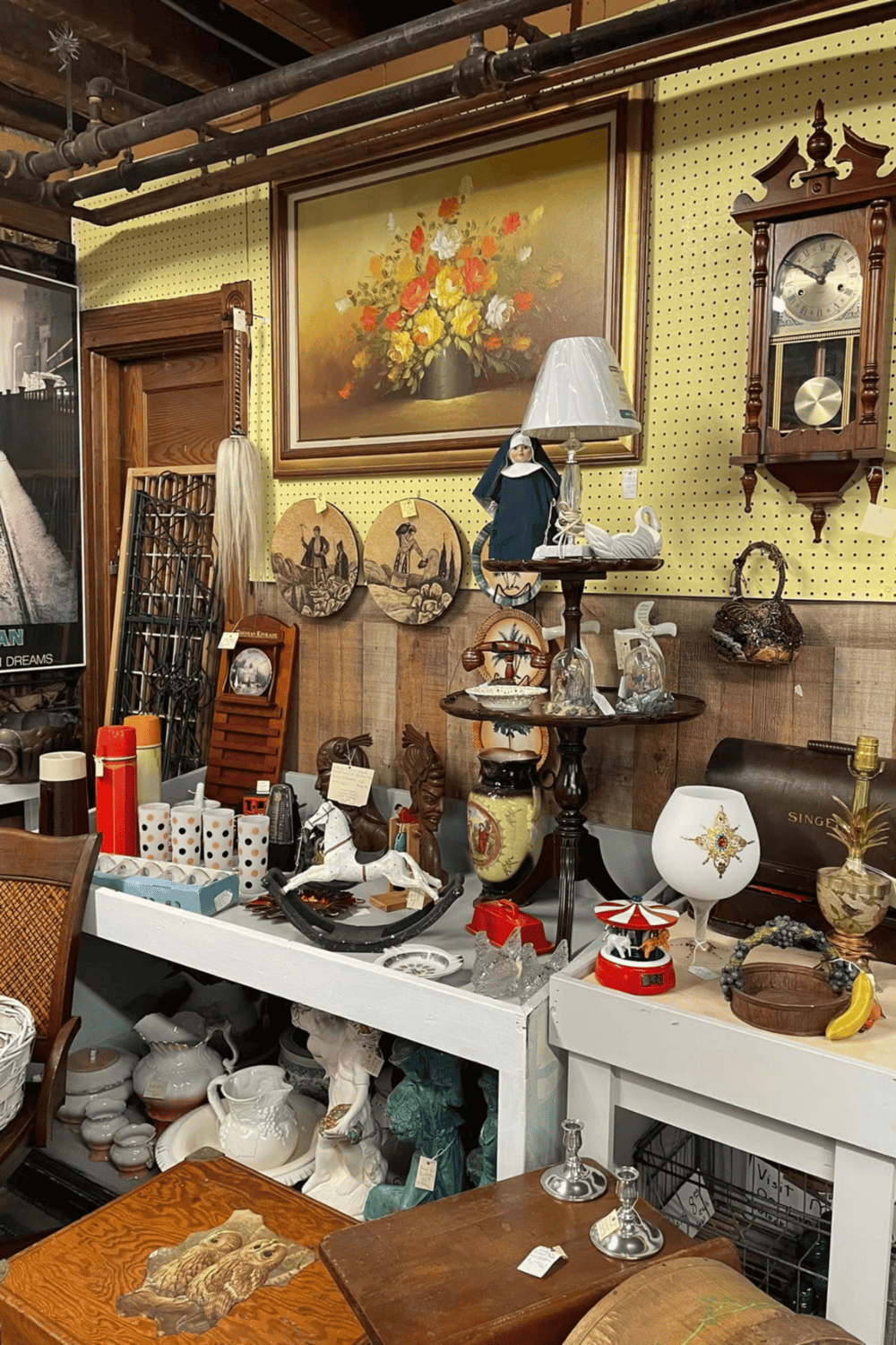 Vintage antique shop with collectible decor and artwork for sale.