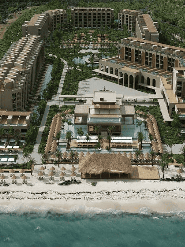 Luxurious beachfront resort with pools, palm trees, and ocean access for ultimate relaxation.