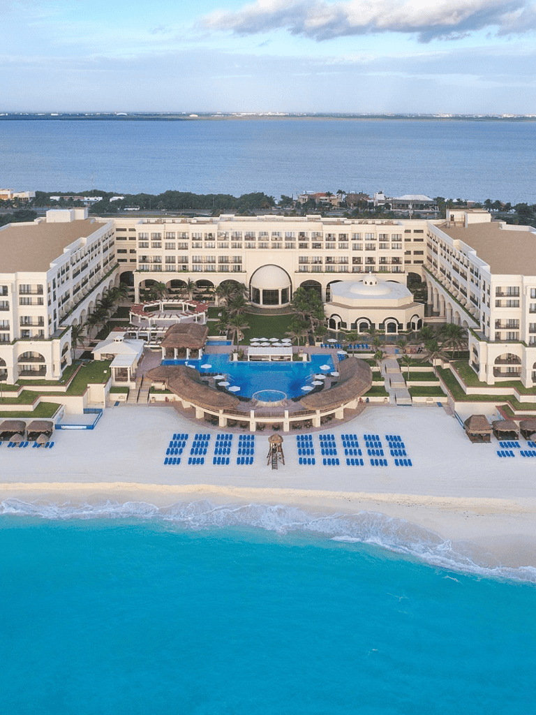 Luxurious beachfront resort with infinity pool, ocean views, and modern amenities.