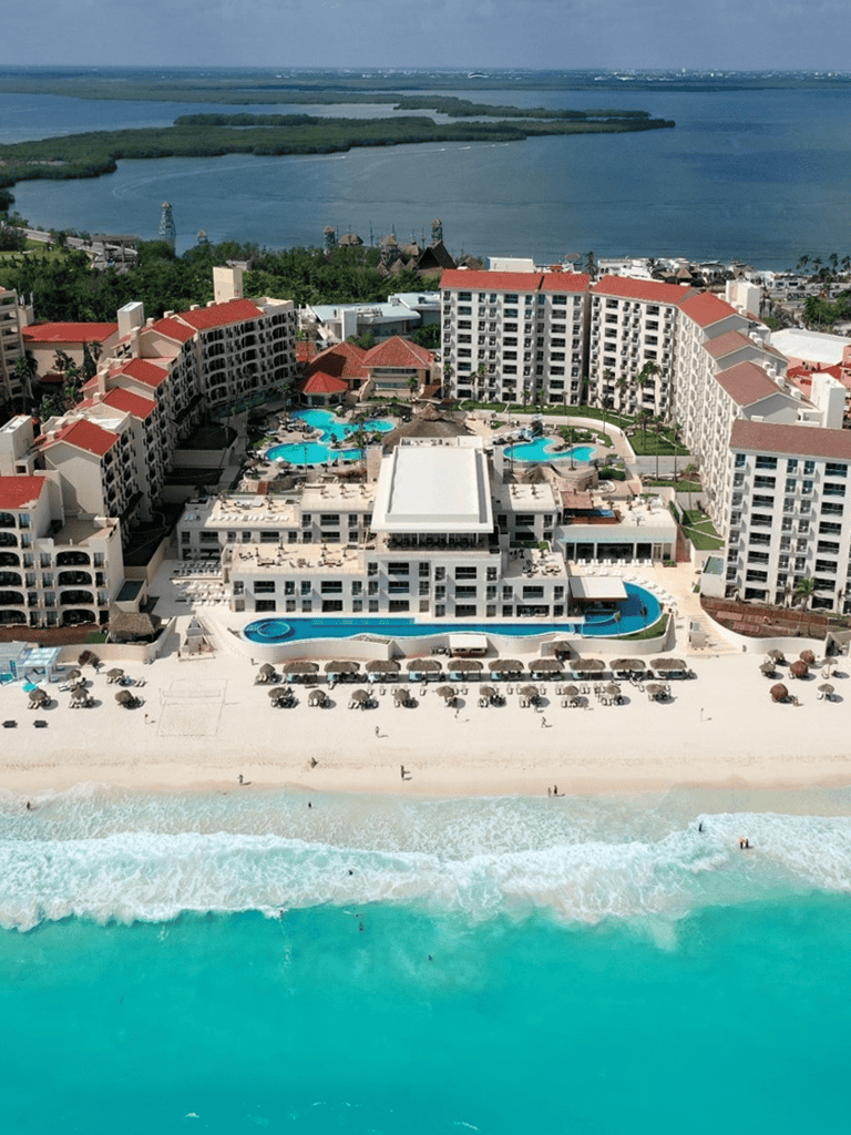 Luxury beachfront resort with pools and ocean views in Cancun.
