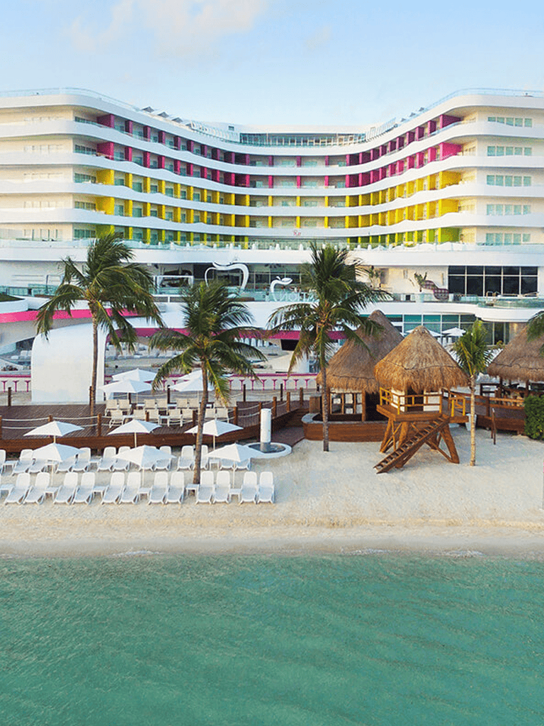 Luxury beachfront resort with colorful modern architecture and tropical ambiance.